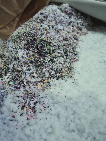 Preparing the collected clothes as fibers for papermaking.